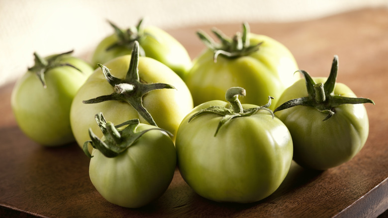seven stemmed green tomatoes