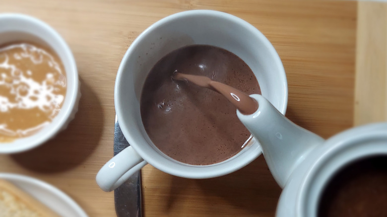 Caribbean chocolate tea being poured into cup
