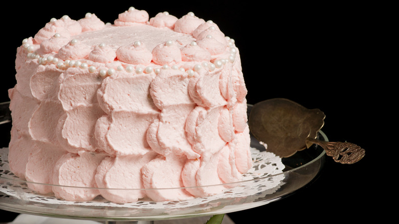 Scalloped cake on stand 