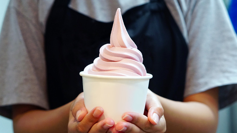 Woman holding frozen yogurt
